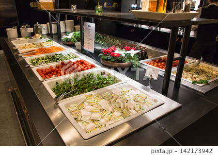 Stockholm, Sweden, December 10 2015: Buffet with salads and food selection in airline lounge Stockholm, Sweden, December 10 2015: Buffet with salads and food selection in airline lounge 142173942