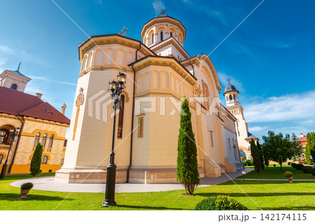 alba iulia, romania - 13 oct 2019: coronation cathedral. holy trinity romanian orthodox cathedral located in alba iulia citadel. sunny autumn day. popular travel destination in europe alba iulia, romania - 13 oct 2019: coronation cathedral. holy trinity romanian orthodox cathedral located in alba iulia citadel. sunny autumn day. popular travel destination in europe 142174115