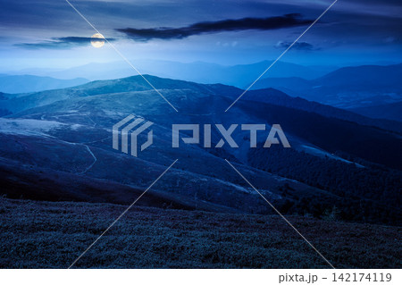 Carpathian mountain landscape in late summer at night. full moon over scenic view of Transcarpathia region from the Great Summit. mysterious alpine blueberry field on Polonyna Play hill 142174119