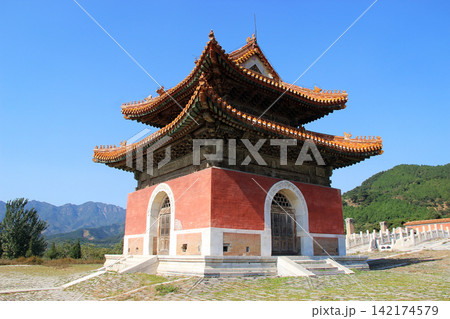 Chinese Temple with Ornate Roof and Mountain Landscape 142174579