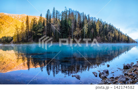 Mountain Lake Reflection with Forest and Morning Mist Mountain Lake Reflection with Forest and Morning Mist 142174582