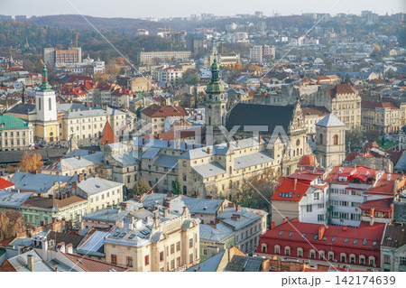 Historic European Cityscape with Church Towers and Old Town Rooftops 142174639