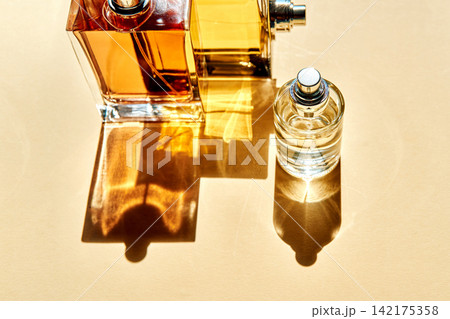 Fragrance layering concept with perfume bottles creating shadows Fragrance layering concept with perfume bottles creating shadows 142175358