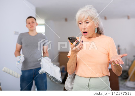 Senior woman disappointed by teenager she employed in construction site Senior woman disappointed by teenager she employed in construction site 142177515