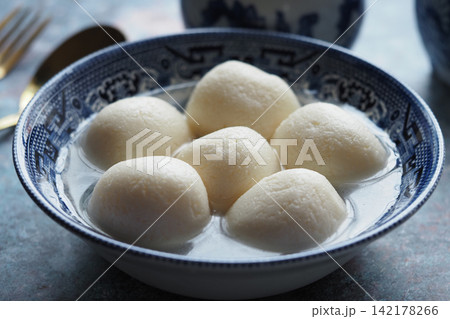Sweet rice balls in a bowl with coconut milk Sweet rice balls in a bowl with coconut milk 142178266