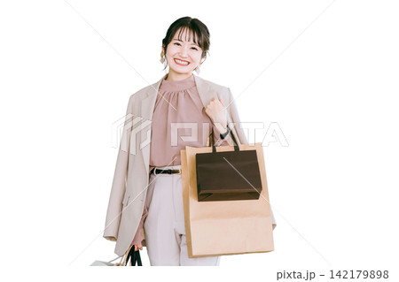 買い物・ショッピング・爆買い・無駄遣いするビジネスウーマン・女性 買い物・ショッピング・爆買い・無駄遣いするビジネスウーマン・女性 142179898