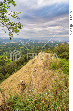 View of the mountains and Kislovodsk from the observation decks of the Kislovodsk Park. Evening sunset over the mountains of Kislovodsk. View of the mountains and Kislovodsk from the observation decks of the Kislovodsk Park. Evening sunset over the mountains of Kislovodsk. 142180339