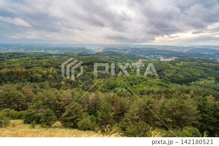 Layers of green mountains and hills in the haze during sunset. Panoramic View of Green hills and Meadow. Layers of green mountains and hills in the haze during sunset. Panoramic View of Green hills and Meadow. 142180521