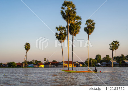 Bugis fisherman's boat at sunset on Lake Tempe, Sulawesi, Indonesia Bugis fisherman's boat at sunset on Lake Tempe, Sulawesi, Indonesia 142183732