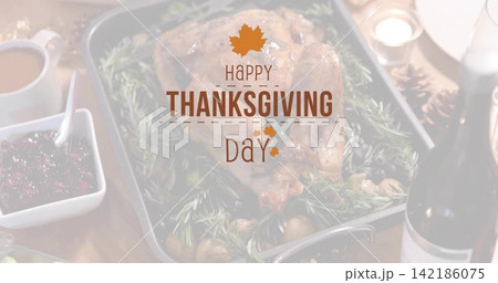 Showing roasted turkey resting on pan on table, with cranberry, wine, candle, Thanksgiving overlay 142186075