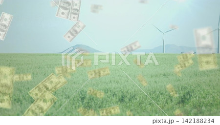Wind blowing through crops, sending faint dollar bills past turbines, showing farm finance Wind blowing through crops, sending faint dollar bills past turbines, showing farm finance 142188234