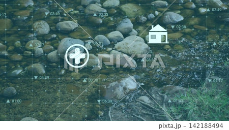 Flowing shallow rocky stream revealing stones and grassy bank, showing teal grid with plus or house Flowing shallow rocky stream revealing stones and grassy bank, showing teal grid with plus or house 142188494