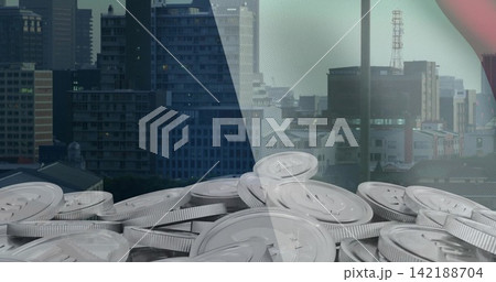 Displaying pile of silver coins on rooftop, split by glass panel, skyline antenna, mesh, red arc 142188704
