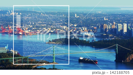 Spanning green suspension bridge across harbor channel, showing cargo ship container cranes overlay Spanning green suspension bridge across harbor channel, showing cargo ship container cranes overlay 142188705