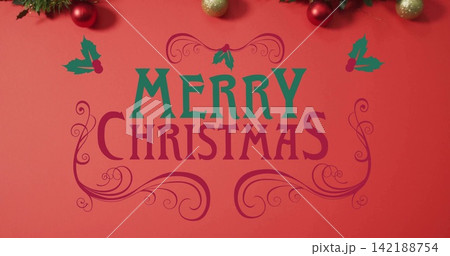 Centered MERRY CHRISTMAS text filling red banner showing two-color letters, holly, garland, baubles Centered MERRY CHRISTMAS text filling red banner showing two-color letters, holly, garland, baubles 142188754