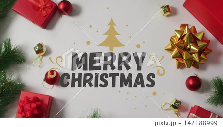 Framing MERRY CHRISTMAS with gold tree, red gifts, gold bow, baubles, bells, pine on white paper Framing MERRY CHRISTMAS with gold tree, red gifts, gold bow, baubles, bells, pine on white paper 142188999