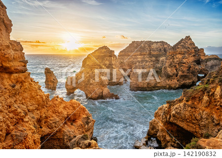 Ponte da Piedade sea stacks and ocean cliffs at sunrise in Lagos Ponte da Piedade sea stacks and ocean cliffs at sunrise in Lagos 142190832