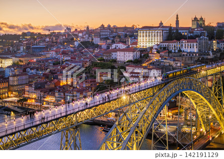 Porto tram at twilight on illuminated Luis I Bridge over Douro River Porto tram at twilight on illuminated Luis I Bridge over Douro River 142191129