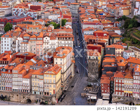 Drone View of Porto historic center street and red rooftops Drone View of Porto historic center street and red rooftops 142191209
