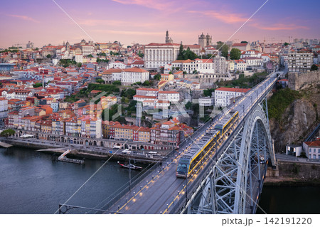 Porto Ribeira tram at sunrise on Luis I Bridge over Douro River Porto Ribeira tram at sunrise on Luis I Bridge over Douro River 142191220