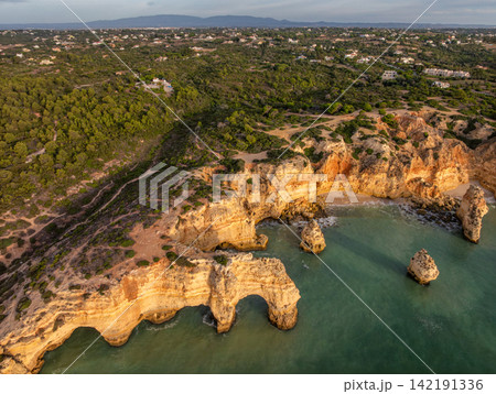 Drone View of Praia da Marinha Cliffs and Coastal Cove Drone View of Praia da Marinha Cliffs and Coastal Cove 142191336