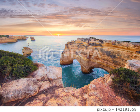 Praia da Marinha beach scenic ocean cliffs and sea stacks Algarve Portugal Praia da Marinha beach scenic ocean cliffs and sea stacks Algarve Portugal 142191359