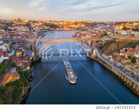 Drone View of Douro River tourist boat near Dom Luis I Bridge Drone View of Douro River tourist boat near Dom Luis I Bridge 142191413