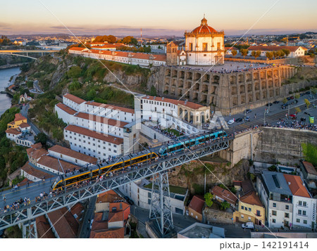 Drone View of Serra do Pilar monastery with tram on bridge 142191414