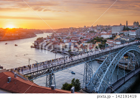 Porto sunset river boats near Luis I Bridge over Douro River city panorama Porto sunset river boats near Luis I Bridge over Douro River city panorama 142191419