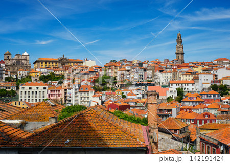 Wide Porto cityscape with Clerigos Tower and red rooftops Wide Porto cityscape with Clerigos Tower and red rooftops 142191424