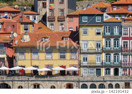 Porto Ribeira houses over Douro, Portugal, UNESCO architecture, blue facade Porto Ribeira houses over Douro, Portugal, UNESCO architecture, blue facade 142191432