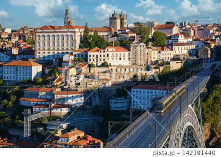 Porto tram on Luis I Bridge with Ribeira cityscape in Portugal Porto tram on Luis I Bridge with Ribeira cityscape in Portugal 142191440