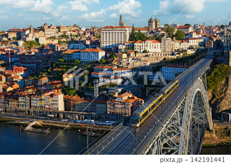 Porto tram and river boats by Luis I Bridge over Douro River Porto tram and river boats by Luis I Bridge over Douro River 142191441