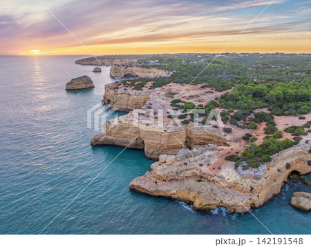 Drone Sunset View of Arco de Albandeira Along Rugged Coastline Drone Sunset View of Arco de Albandeira Along Rugged Coastline 142191548