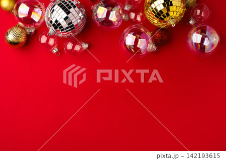 Christmas ornaments on a red background. Christmas ornaments on a red background. 142193615