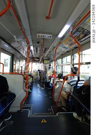 Interior of a Japanese passenger bus with people traveling 142194369