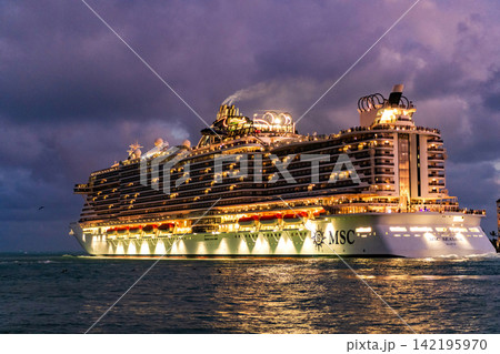 Miami, Florida, USA - December 16, 2024: MSC cruises cruise line. Cruise ship tour and travel at sea. Illuminated ship at sunset. MSC Seaside cruise ship voyage. Cruise in summer vacation Miami, Florida, USA - December 16, 2024: MSC cruises cruise line. Cruise ship tour and travel at sea. Illuminated ship at sunset. MSC Seaside cruise ship voyage. Cruise in summer vacation 142195970