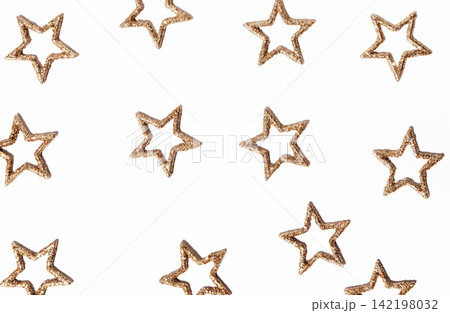 Golden Glitter Stars on White Background Golden Glitter Stars on White Background 142198032