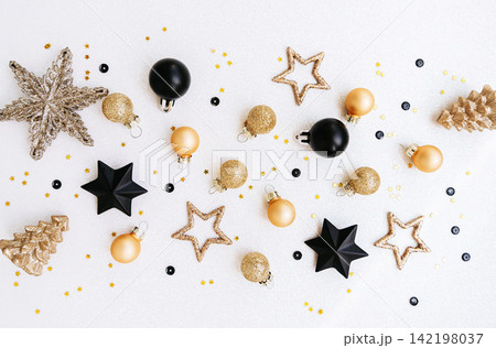 Black and Gold Christmas Decorations on White Background 142198037