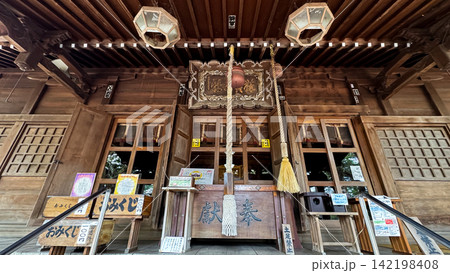 Wide front view of a wooden Shinto shrine offering area Wide front view of a wooden Shinto shrine offering area 142198408