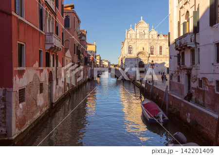 Venetian Canal with Historic Architecture and Bridge in Venice, Italy Venetian Canal with Historic Architecture and Bridge in Venice, Italy 142201409