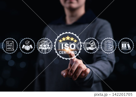 ISO Certification and quality management system concept. Businessperson pointing at ISO certified and quality assurance icon, international standards, corporate compliance and operational excellence. ISO Certification and quality management system concept. Businessperson pointing at ISO certified and quality assurance icon, international standards, corporate compliance and operational excellence. 142201705