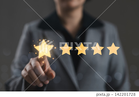 Five star rating and customer satisfaction review concept. Person touching star rating representing service quality evaluation, client feedback, positive experience, brand trust, reputation management 142201728