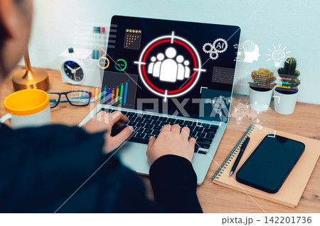 AI audience targeting concept. Person works on laptop with customer icon, charts, data dashboard, and analytics interface for digital marketing, segmentation, business insight, and campaign strategy 142201736