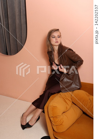 Elegant lady in stylish attire strategizes with focused intent Elegant lady in stylish attire strategizes with focused intent 142202537