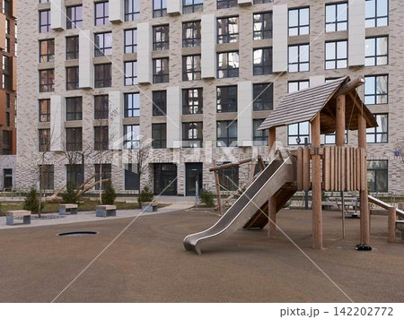 Real estate image highlighting playground features and environment 142202772
