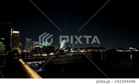 Illuminated Yokohama Waterfront Skyline and Ferris Wheel at Night 142204446