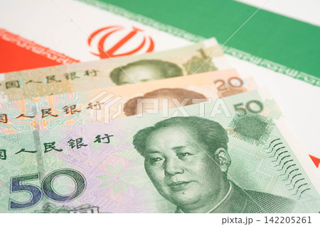 China yuan banknote money with Iran flag, investment economy business and banking. China yuan banknote money with Iran flag, investment economy business and banking. 142205261