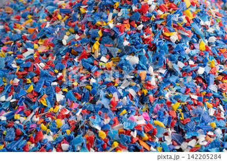 Plastic colorful pieces recycling shredded for industrial use. Plastic colorful pieces recycling shredded for industrial use. 142205284