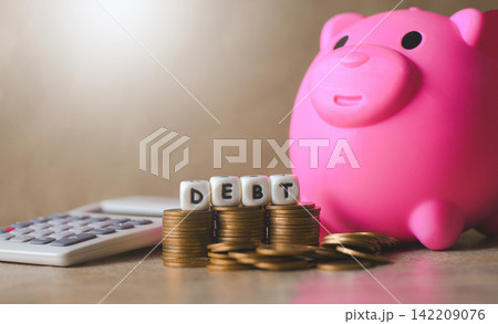 Block word debt on pile of coins with calculator and piggy bank, Payment of taxes and of debt to the state, Concept of financial crisis and problems risk management debt exemption loan Block word debt on pile of coins with calculator and piggy bank, Payment of taxes and of debt to the state, Concept of financial crisis and problems risk management debt exemption loan 142209076